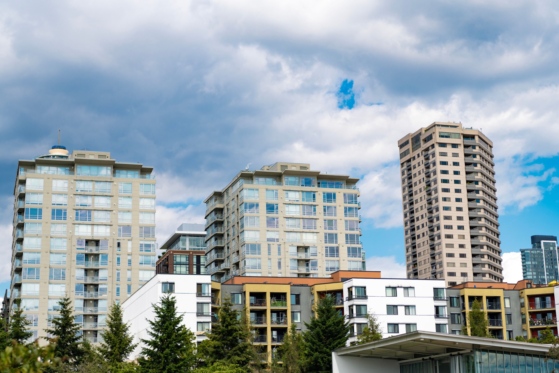 Modern condominium building. Architectural building in neighborhood. Building cityscape. Condominium architecture. Architecture of residential building. Residential house Modern condominium building. Architectural building in neighborhood. Building cityscape. Condominium architecture. Architecture of residential building. Residential house